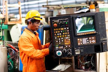 Man Worker at industrial factory wearing uniform and hard hats. Engineering and architecture concept