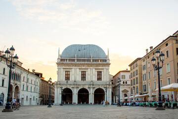 Panoramic view of Loggia palace ( palazzo della loggia) of Brescia square during sunset at the end...