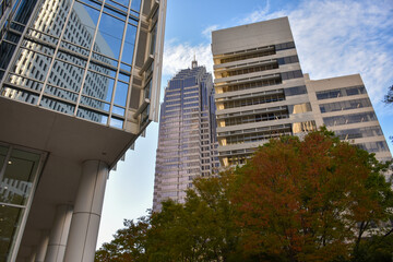 Obraz premium City architecture with a blue sky and clouds 