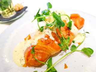 Delicious fresh croissant on table