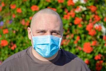 Young man wearing a surgical face mask