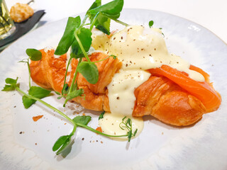 Delicious fresh croissant on table