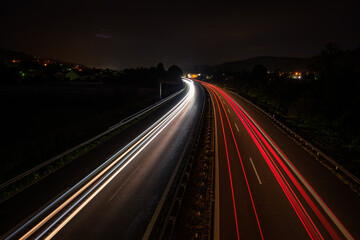 Fototapeta na wymiar Motion blur with car light traisl on a road