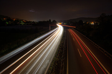 Fototapeta na wymiar Car and truck traffic lights in night road
