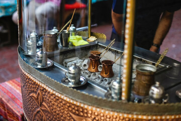 Black Arab coffee is prepared on hot coals in Turk in a tent in a stall in Turkey in Istanbul.international coffee day