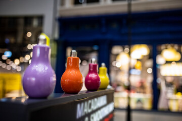 glasses for juices in the form of multi-colored lamps on the counter