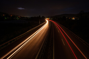 Fototapeta na wymiar LIght trails of cars in the night road
