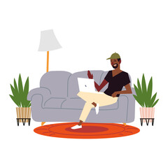 afro american man with laptop on sofa living room, indoor activities