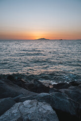 Sunset behing Ischia Island on the Sorrento Coast in Italy