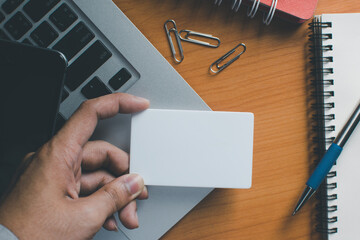 Business people hold credit cards and use computers Online shopping Office concept..