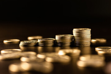 Stacks of gold coins with dark background