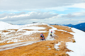 Winter adventure with snowmobile on the mountains 