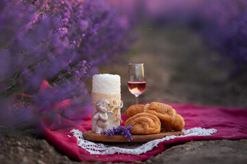 Picnic time with wine in lavender field, France.