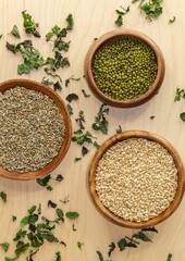 View from above on mung beans, rye seeds and pearl grits, as well as grass melissa