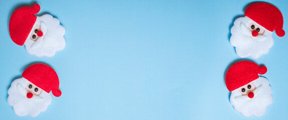 banner santa made of felt on a blue background