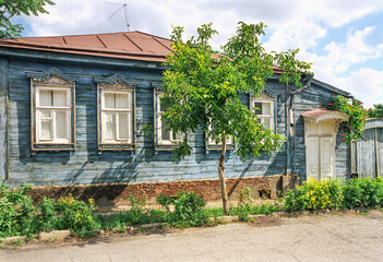 Fototapeta na wymiar An old Russian wooden house from the times of the Russian Empire with elements of carved decorations. Astrakhan, Russia.