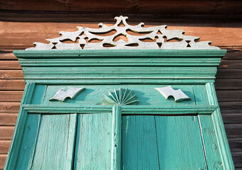 Fragment of the Window of an old Russian wooden house from the times of the Russian Empire with...