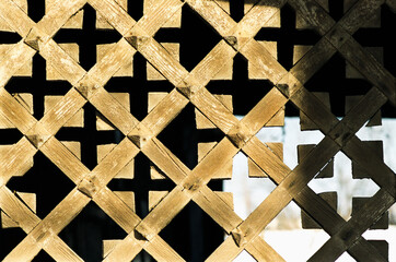 Fototapeta premium Wooden lattice - Element of decoration of the gate Antique Russian wooden house of the times of the Russian Empire