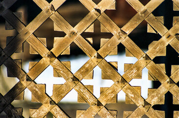 Wooden lattice - Element of decoration of the gate Antique Russian wooden house of the times of the...