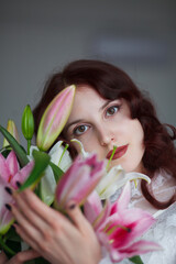 beautiful girl with a bouquet of lilies