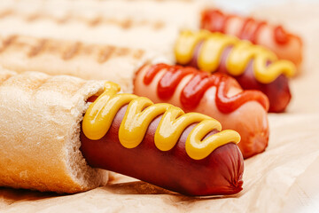 classic American hot dog with mustard and ketchup close-up