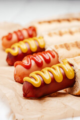 classic American hot dog with mustard and ketchup close-up