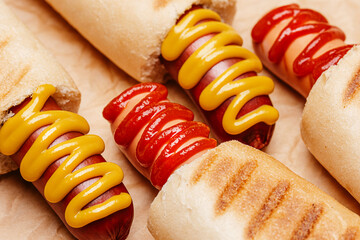 classic American hot dog with mustard and ketchup close-up