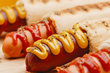 classic American hot dog with mustard and ketchup close-up
