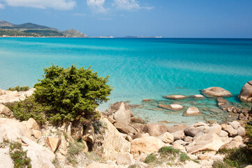Fototapeta na wymiar Emerald water in Notteri beach, Villasimius, Cagliari, Sardinia, Italy, Europe