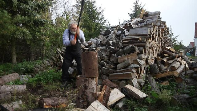 man chops wood