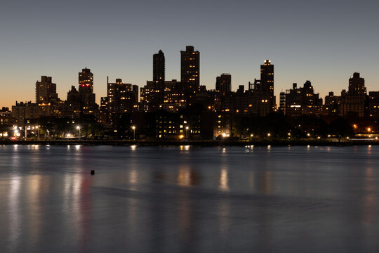 Upper East Side and Manhattan Skyline at Night along the East River in New York City