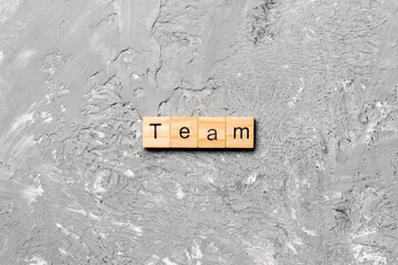 team word written on wood block. team text on cement table for your desing, concept
