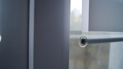 Metal weights with a plastic cap for roller blinds. Day and night system. It's a nasty day. Comfort and refinement of the house. Window accessories.