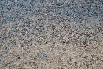 Atlantic Ocean coast with colorful stones of emerald water shells