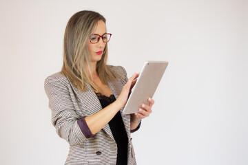 Businesswoman holding tablet in hands isolated