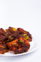 The close-up shot of Sambal petai udang (shrimp petai sauce) is a typical asian cuisine food. food made from shrimp, petai, and chili sauce. Isolated on white background