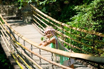 The little girl on the suspension bridge.