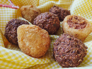 mini party snacks in basket with yellow towel and photo captured with selective focus