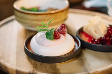 Delicious desserts on a raspberry and yogurt tray
