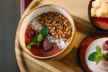 Healthy breakfast of cereals and strawberries on a tray
