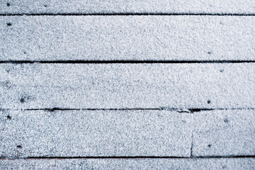 Obraz premium Wooden floor covered with fresh snow. Christmas and winter background.