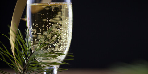 Christmas background, champagne glasses on a wooden surface