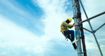 Engineer or Technician wear safety equipment climb high telecom tower for maintenance work,working high risk, Installation and Preventive maintenance on telecommunication network 