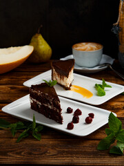 chocolate cake with berries and chocolate dessert with coconut and mint and syrup
