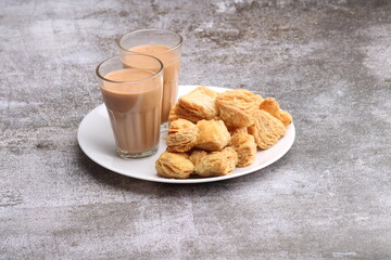 indian khari or kharee or salty Puff Pastry Snacks, served with indian hot tea.