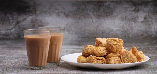indian khari or kharee or salty Puff Pastry Snacks, served with indian hot tea.