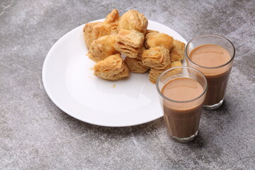 indian khari or kharee or salty Puff Pastry Snacks, served with indian hot tea.