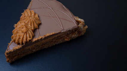chocolate caramel cake on black table