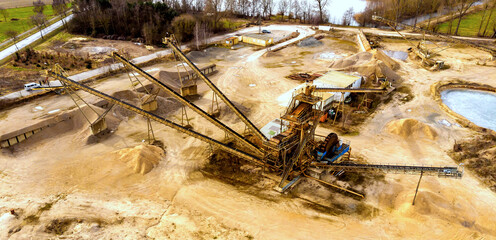 Oblique aerial photograph with the overall view of a large processing machine when used in a sand...