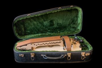 hurdy-gurdy in case isolated on black..